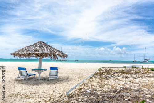 beach chairs and umbrella