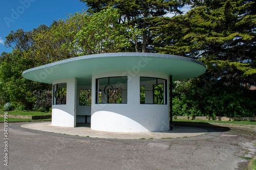 Littlehampton, West Sussex, UK, May 11, 2020, View of a beautiful Art Deco shelter next to a lake in Mewsbrook Park which was opened in 1939. photo