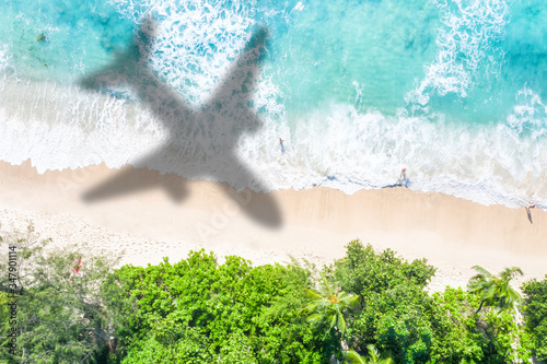 Symbolic picture vacation travel traveling sea airplane flying Seychelles beach