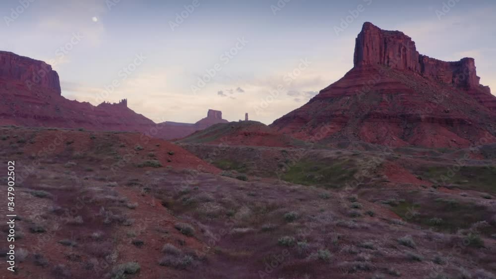Moab, Utah. Aerial flying over desert canyon with mesa & buttes in Castle Valley