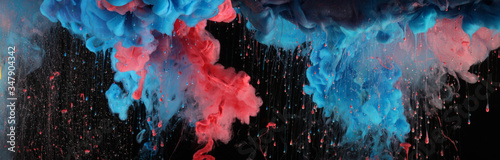Acrylic colors and ink in black water. Ink blot. Abstract background. Horizontal long banner.
