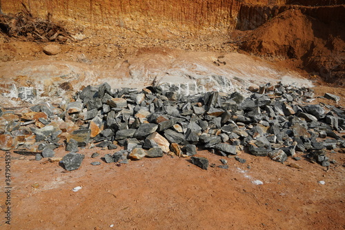 Pile Of Rocks I.E. Lithium Mining And Natural Resources Like Limestone Mining In Quarry. Natural Zeolite Rocks Are Excavated With Deforestation In Background. photo