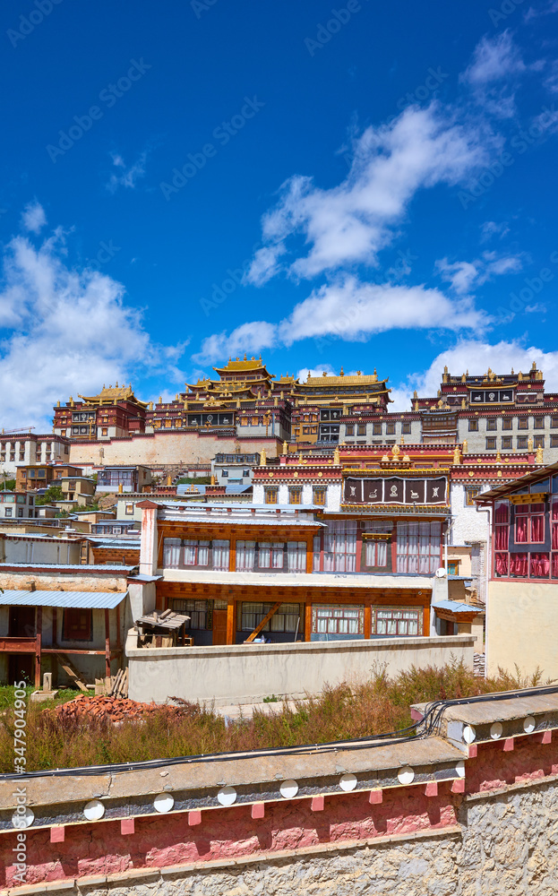 Ganden Sumtsenling Monastery on a sunny day (also known as Sungtseling or Little Potala Palace), Yunnan, China.
