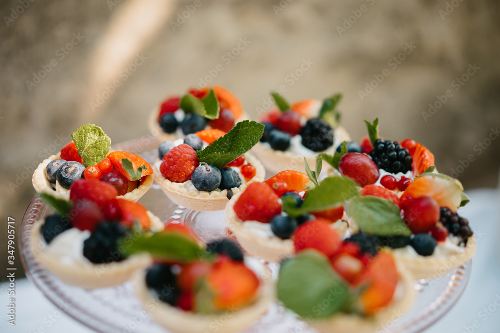 photo of small berries tartelette in a plate photo of small berries tartelette in a plate