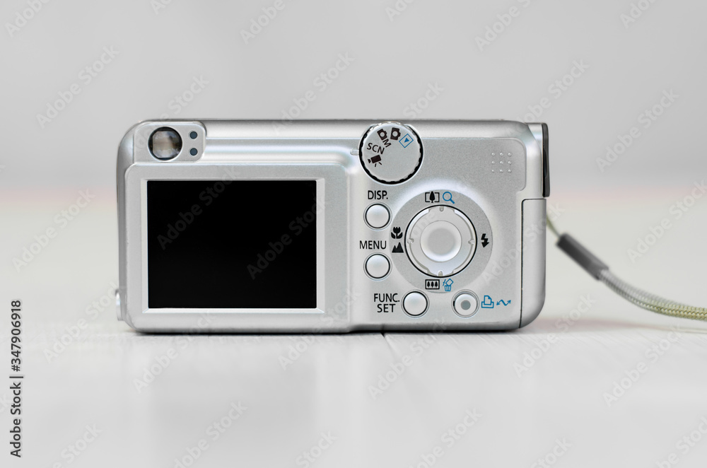 Old camera on a light background. Close-up camera. Back view. Old camera on a light background. Close-up camera. Back view.