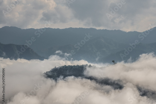 Sea of mist, mountains above the clouds with green forests and mountains ridge and mountains peak. Beautiful in nature landscape, Mae Moei national park, Tak province, Thailand. 