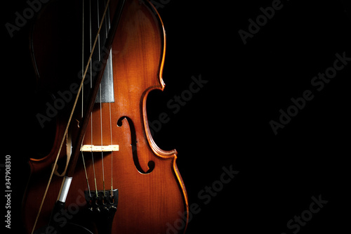Fotótapéta Classic violin and bow on black background. Space for text