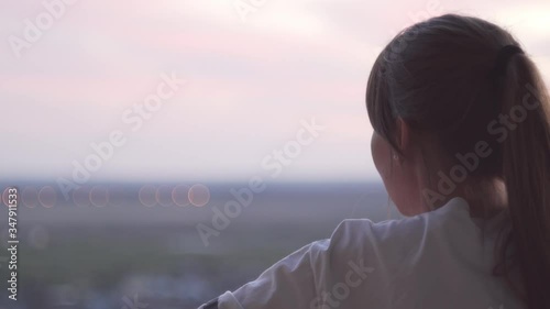 girl looks at the landscape from a height