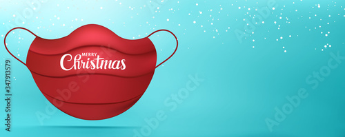 Web Banner Christmas greetings with red medical mask with Merry Christmas writing. Background with snowflakes. Coronavirus. Best wishes -from or for- healthcare workers or hospital staff
