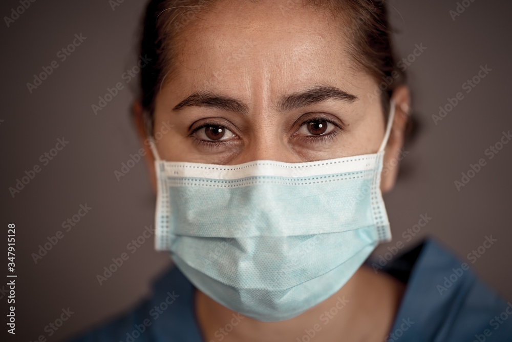 Female Doctor or Nurse Wearing Protective face medical Mask. Save lives from Covid-19 Outbreak Female Doctor or Nurse Wearing Protective face medical Mask. Save lives from Covid-19 Outbreak