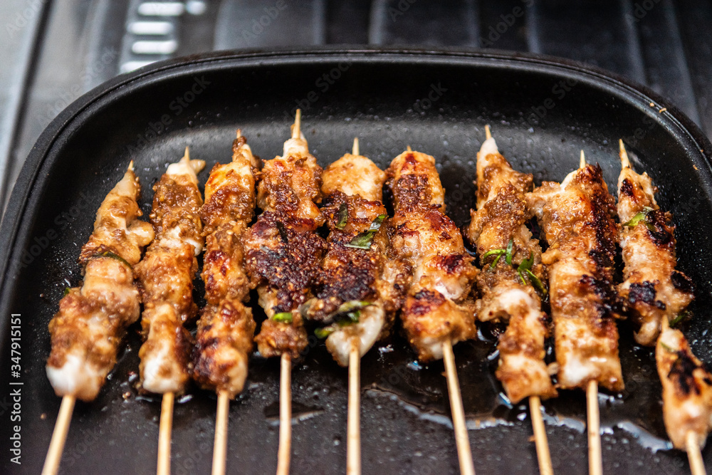 Chicken skewers or meat on the grill Indonesian food satay