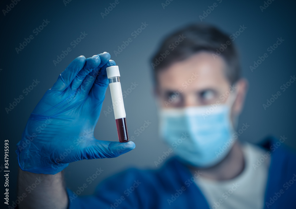 Scientist testing coronavirus positive blood sample researching for COVID-19 antibodies and vaccine Scientist testing coronavirus positive blood sample researching for COVID-19 antibodies and vaccine