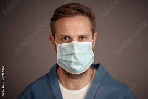 Man Doctor or Nurse Wearing Protective face medical Mask. Save lives from Covid-19 Outbreak