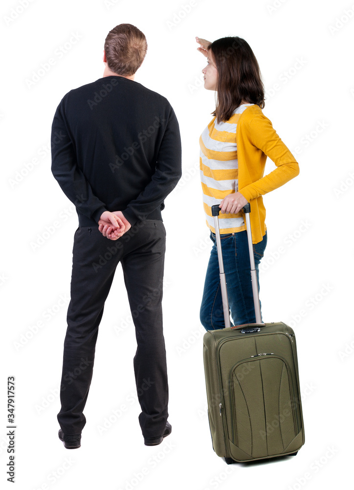 young couple in sweater traveling with suitcas. young couple in sweater traveling with suitcas.