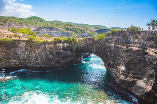 A seascape of Broken beach sea shore green-aqua water wave from the top during the touristic visit in Nusa penida