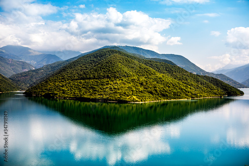 Day time panorama of the lake and mountains. Travel destination of Georgia.