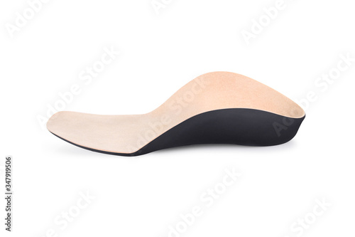 Isolated orthopedic insole on a white background. Treatment and prevention of flat feet and foot diseases. Foot care, comfort for the feet. Wear comfortable shoes. Medical insoles. Flat Feet Correctio
