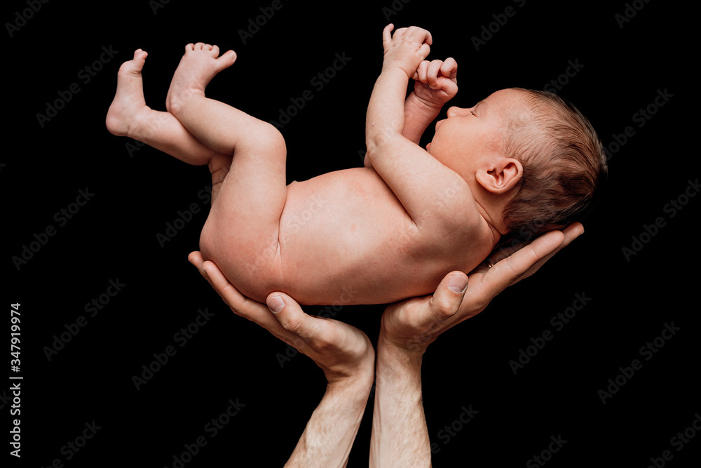 dad holds a newborn baby on a black background sleeps cute dad holds a newborn baby on a black background sleeps cute