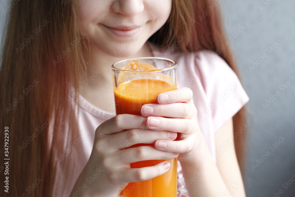 Cute little girl drinking healthy carrot juice. Summer day. Cute little girl drinking healthy carrot juice. Summer day.