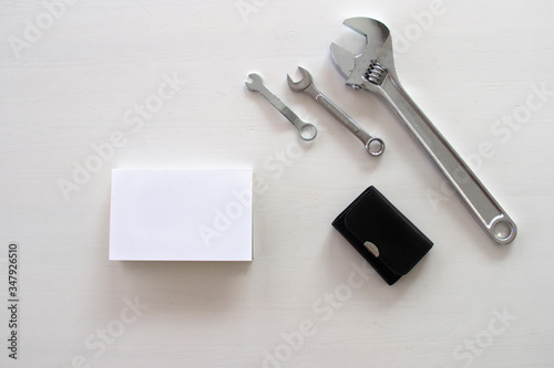 Male tools. Happy Father's Day inscription with screwdriver, Mechanic hand hold spanner tool, pliers Greetings. white card with the ability to insert text, copyspace, congratulation birthday for man,  © Diana