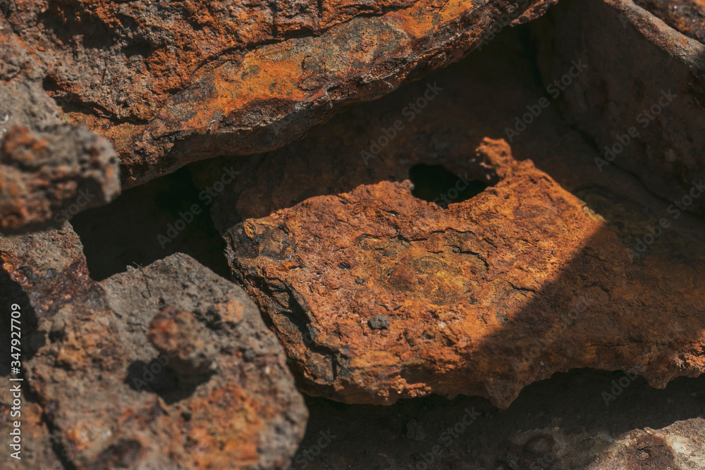 Ecology and recycling. Rusty scrap metal in a landfill in natural light. Details of cars, mechanisms. Ecology and recycling. Rusty scrap metal in a landfill in natural light. Details of cars, mechanisms.