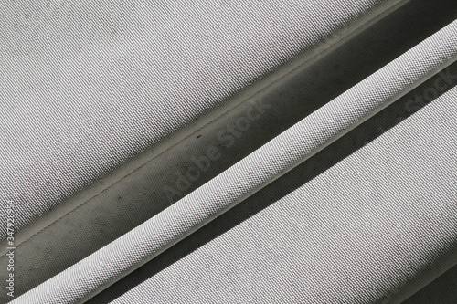 Wrinkled canvas cloth texture background. Beige tent cloth. Background from beige tent cloth.