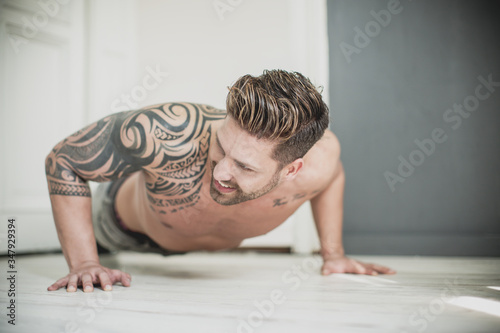 young man doing home workout