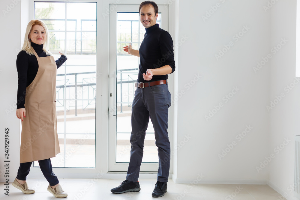 Couple is owner of a cafe or waitress and waiter working Couple is owner of a cafe or waitress and waiter working