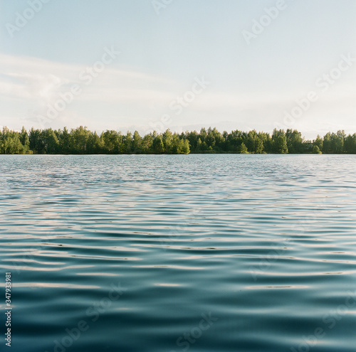 Calm lake near the forest photo