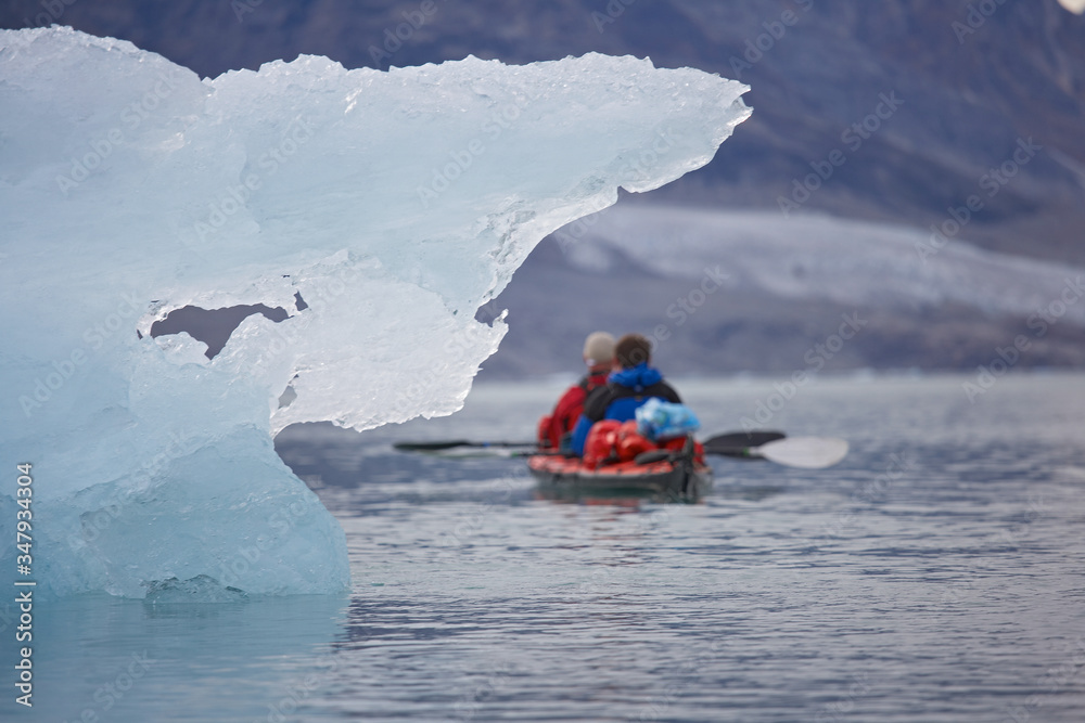 2 men traveling with a sea kayak in Eastern Greenland 2 men traveling with a sea kayak in Eastern Greenland