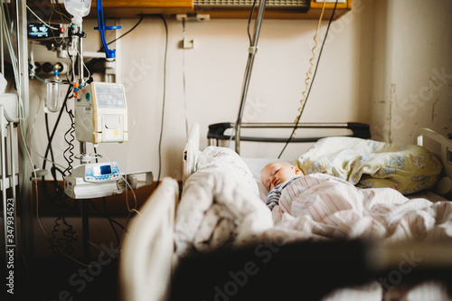 Baby child sick at the hospital with a virus coronavirus photo