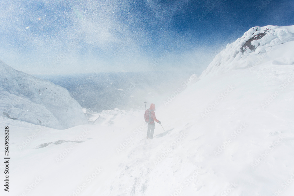A man climbs down from the summit of Mt. Hood in Oregon. A man climbs down from the summit of Mt. Hood in Oregon.