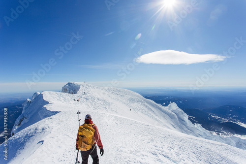 A man climbs to the summit of Mt. Hood in Oregon. photo