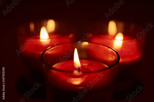 Some burning red candles