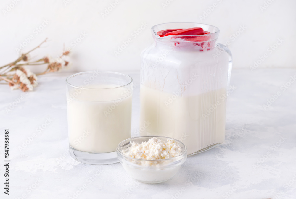 Dairy products on a white background kefir, milk, granules of bacteria. Fermented food