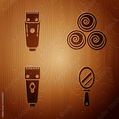 Set Hand mirror, Electrical hair clipper or shaver, Electrical hair clipper or shaver and Towel rolls on wooden background