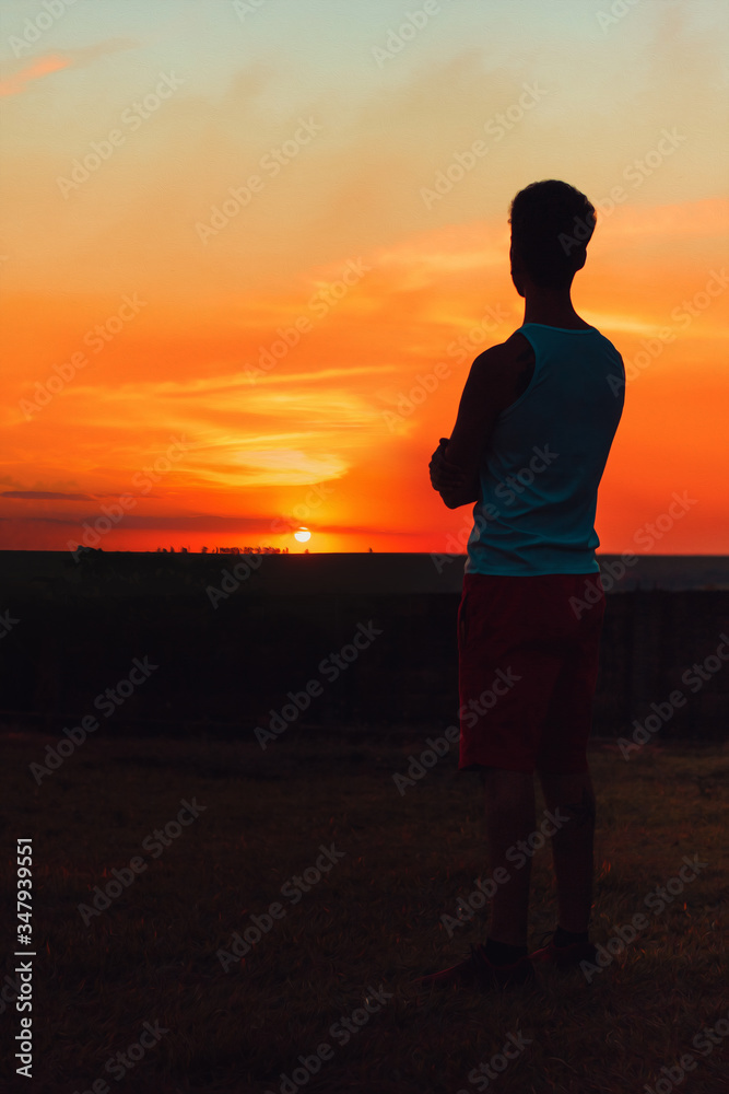 Adult black man at sunset blackground Adult black man at sunset blackground
