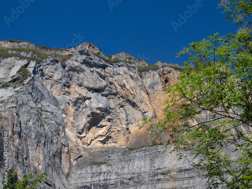 The famous Becco dell'Aquila on Monte Brento (Eagle's beak on Mount Brento). This is one of the most popular base jumping spot in Europe. Several divers with parachute or wingsuits jump from Brento photo