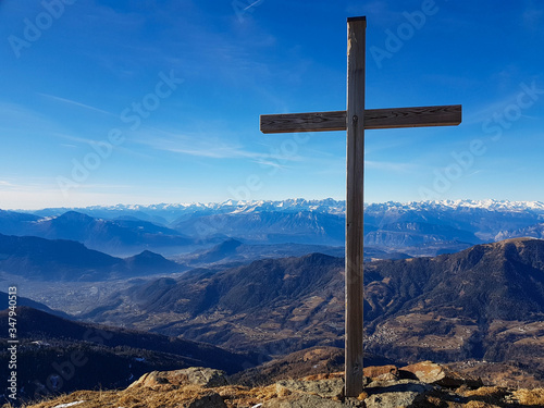 View of the cross on top of mount Gronlait in the Lagorai group near Trento
