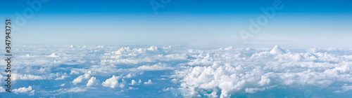 Fototapeta Naklejka Na Ścianę i Meble -  Clouds top view of the airplane. Heavenly landscape.