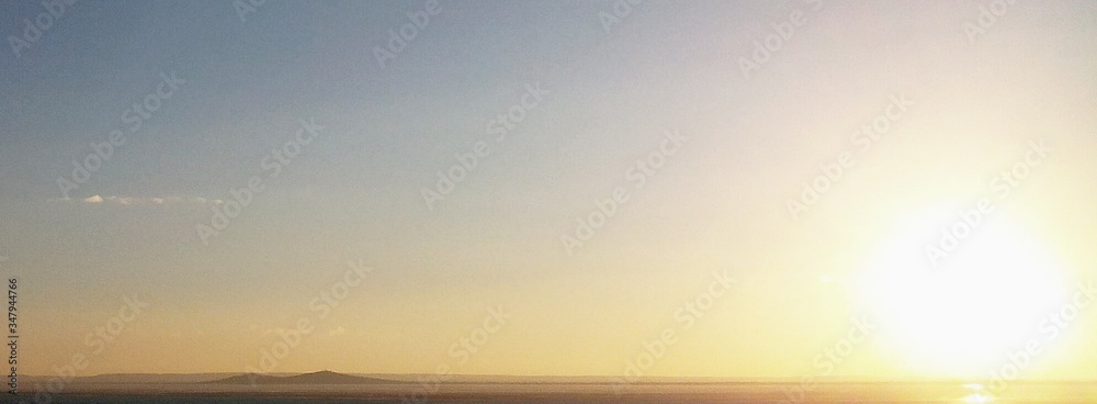 Scenic View Of Sunset Over Calm Sea