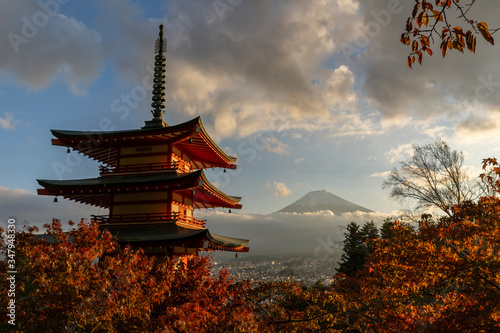Landscape image of Fuji mountain with Chureito Pagoda and red leaf in the autumn on sunset at Fujiyoshida  Japan.