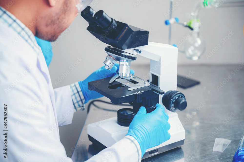 Closeup of Scientific microscope data analysis in the laboratory Closeup of Scientific microscope data analysis in the laboratory