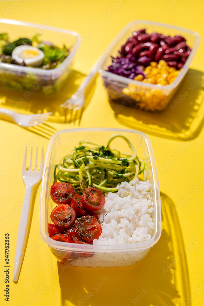 Homemade vegan food in lunch boxes with healthy vegetable fresh from above. Vegan food concept. Healthy food. Flat lay. Top view Homemade vegan food in lunch boxes with healthy vegetable fresh from above. Vegan food concept. Healthy food. Flat lay. Top view