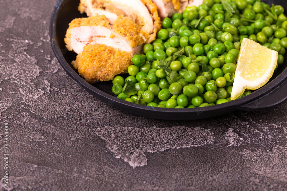 Chicken grilled fillet filled with julienne, lemon and steamed green pea. Healthy food, ketogenic diet. Keto/Paleo Chicken grilled fillet filled with julienne, lemon and steamed green pea. Healthy food, ketogenic diet. Keto/Paleo