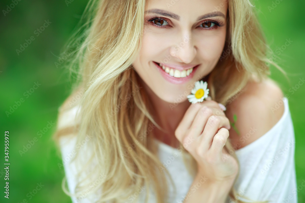 Beautiful woman with a flower. Girl with camomiles. Beautiful woman portrait. Beautiful woman with a flower. Girl with camomiles. Beautiful woman portrait.
