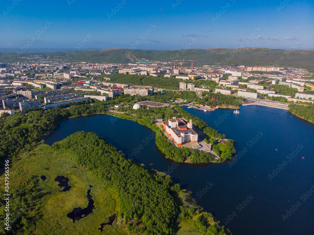 Murmansk, Russia - July 1, 2019: Aerial view panorama of city holiday park with Semonovskoye lake