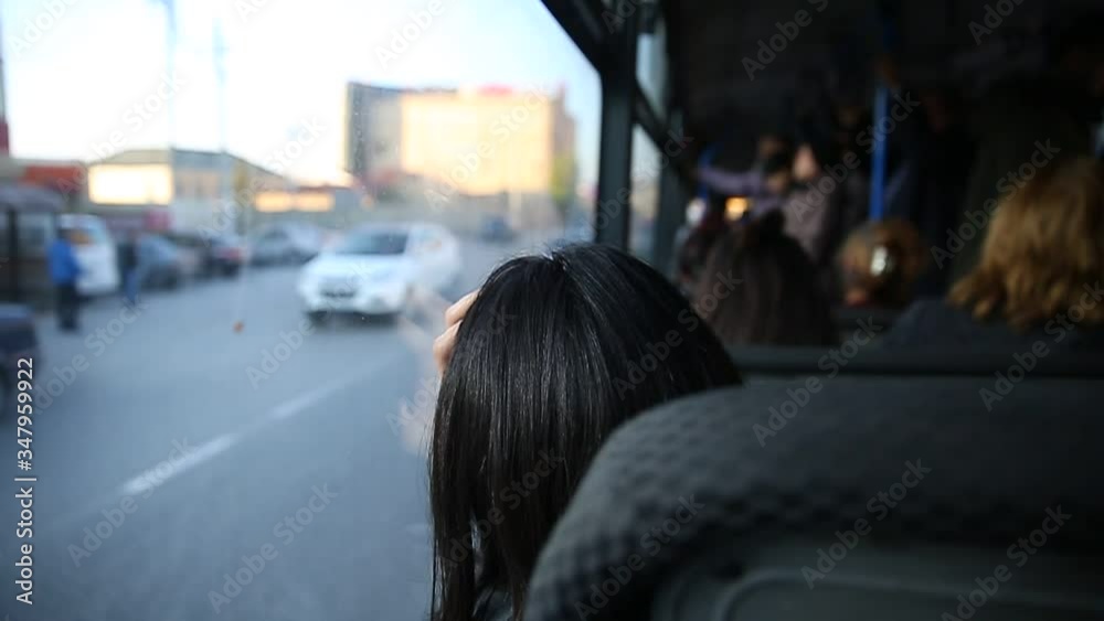 People in old public bus, view from inside the bus . People sitting on a comfortable bus in Selective focus and blurred background. the main mass transit passengers in the bus.