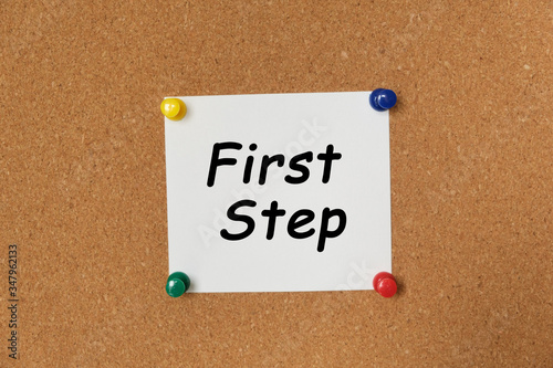 Text First Step written on a sticker