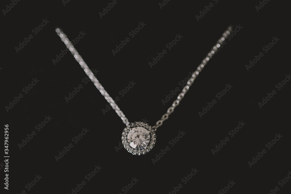 Naklejka premium Diamond necklace close up on black background